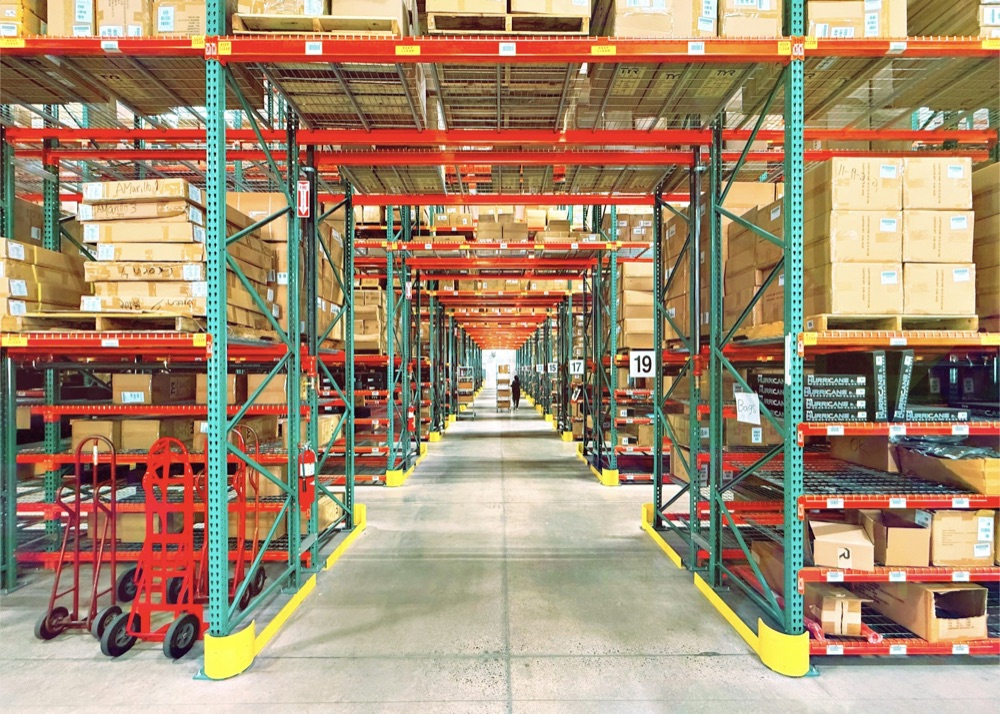 Organized warehouse with pallet racking and a finished concrete floor