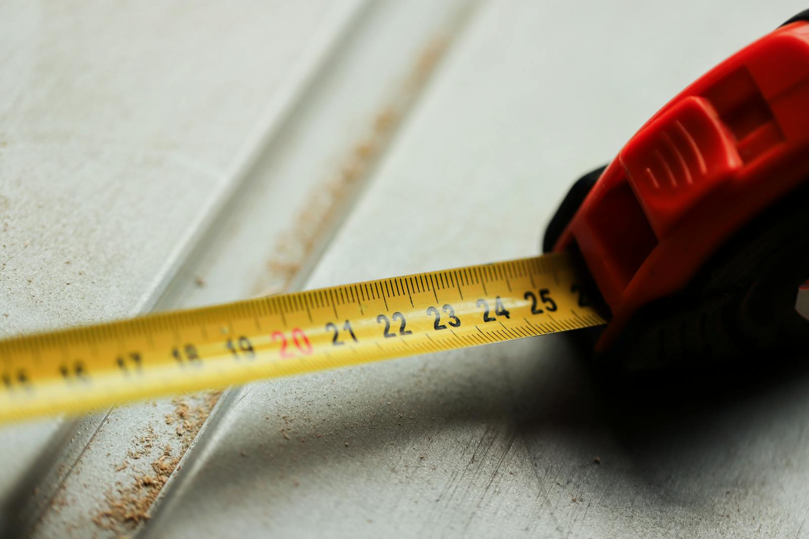 Tape measure on a job site during a flooring estimate